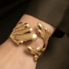 Camélia — Gold Textured Flower Bracelet worn on wrist