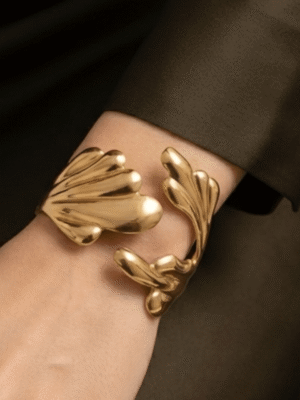 Camélia — Gold Textured Flower Bracelet worn on wrist Camélia — Gold Textured Flower Bracelet worn on wrist