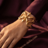 Serpentine — Gold Coiled Snake Cuff Bracelet worn on wrist