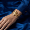 Camélia — Gold Textured Flower Bracelet worn on wrist