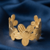 Camélia — Gold Textured Flower Bracelet worn on wrist