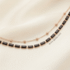 1 Aqs — Gold and Balck Beaded Anklet