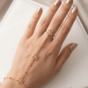 Stylish Hand Chain by Amora — Gold Heart Charm Hand Chain worn on hand