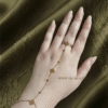 Trèfle — Gold Clover Hand Chain worn on hand Trèfle — Gold Clover Hand Chain worn on hand