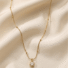 Zeba – Gold Infinity Charm Necklace worn Zeba – Gold Infinity Charm Necklace worn