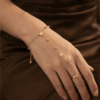 Astra — Gold Star Charm Hand Chain worn on hand Astra — Gold Star Charm Hand Chain worn on hand