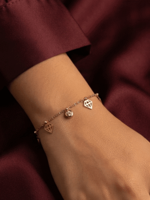 Diamant — Rose Gold Diamond Charm Bracelet worn on wrist Diamant — Rose Gold Diamond Charm Bracelet worn on wrist