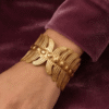 Vela — Gold Ribbed Cuff Bracelet worn on wrist Vela — Gold Ribbed Cuff Bracelet worn on wrist