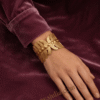 Vela — Gold Ribbed Cuff Bracelet worn on wrist Vela — Gold Ribbed Cuff Bracelet worn on wrist
