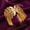 Vela — Gold Ribbed Cuff Bracelet worn on wrist Vela — Gold Ribbed Cuff Bracelet worn on wrist