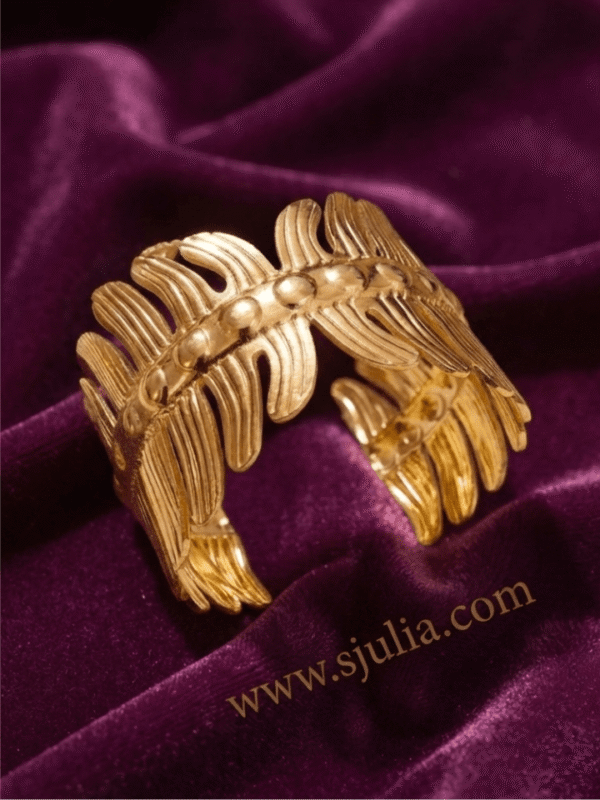 Vela — Gold Ribbed Cuff Bracelet worn on wrist Vela — Gold Ribbed Cuff Bracelet worn on wrist