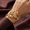 Corail — Gold Starfish Shell Cuff Bracelet worn on wrist Corail — Gold Starfish Shell Cuff Bracelet worn on wrist