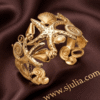 Corail — Gold Starfish Shell Cuff Bracelet worn on wrist Corail — Gold Starfish Shell Cuff Bracelet worn on wrist