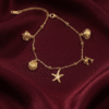 Sahil – Gold Ocean Charm Anklet worn on ankle Sahil – Gold Ocean Charm Anklet worn on ankle