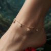 Gulnar – Rose Gold Flower Charm Anklet worn on ankle