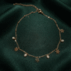 Gulnar – Rose Gold Flower Charm Anklet worn on ankle