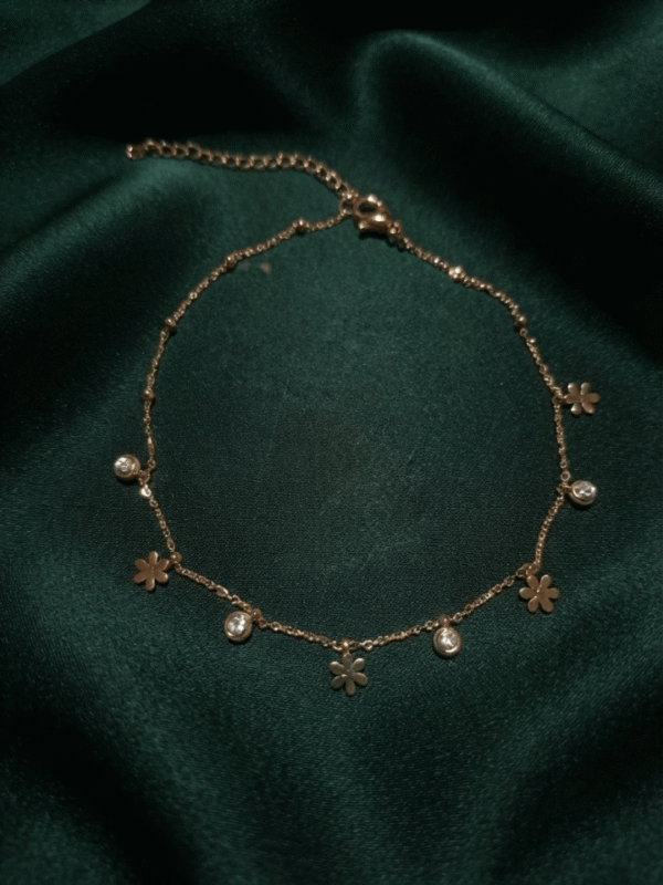 Gulnar – Rose Gold Flower Charm Anklet worn on ankle