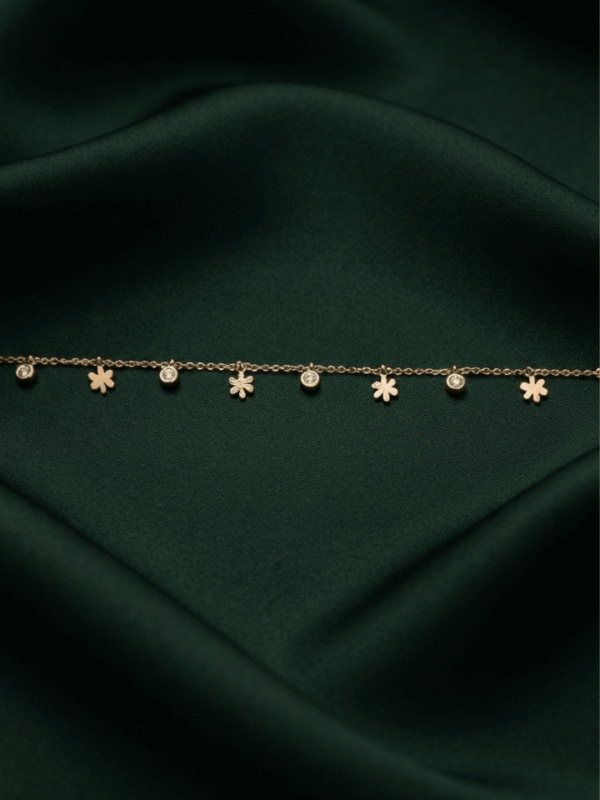 Gulnar – Rose Gold Flower Charm Anklet worn on ankle