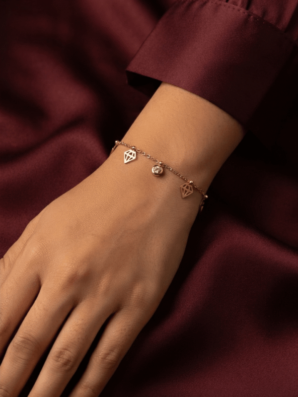 Diamant — Rose Gold Diamond Charm Bracelet worn on wrist Diamant — Rose Gold Diamond Charm Bracelet worn on wrist