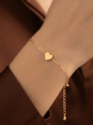 Dil — Gold Heart Charm Bracelet worn on wrist Dil — Gold Heart Charm Bracelet worn on wrist
