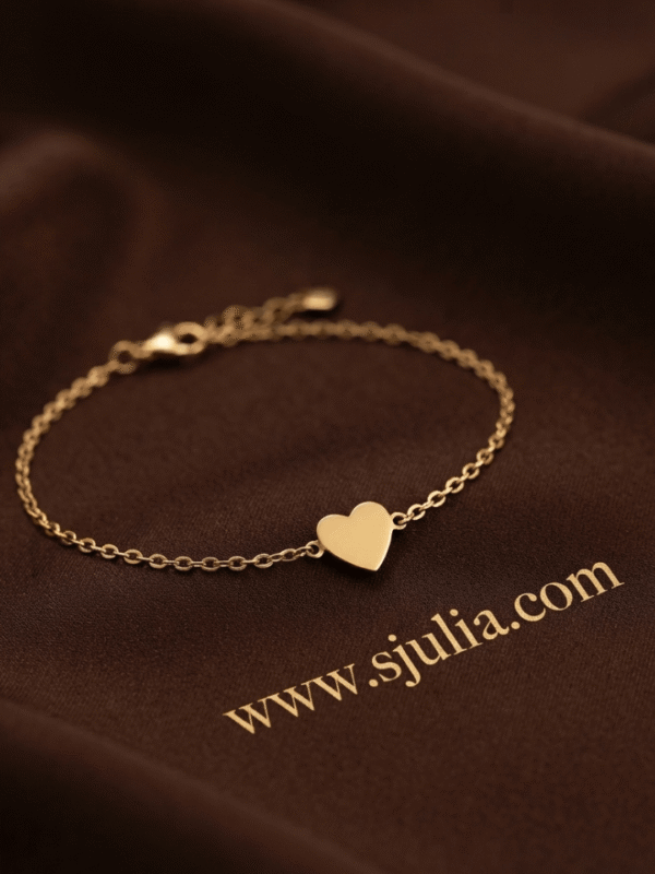 Dil — Gold Heart Charm Bracelet worn on wrist Dil — Gold Heart Charm Bracelet worn on wrist