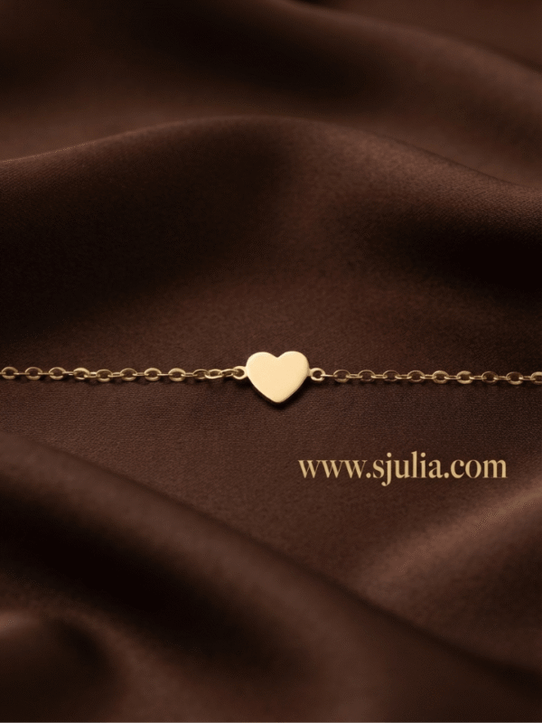 Dil — Gold Heart Charm Bracelet worn on wrist Dil — Gold Heart Charm Bracelet worn on wrist
