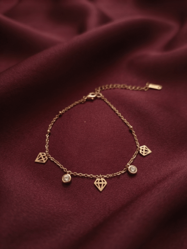 Diamant — Rose Gold Diamond Charm Bracelet worn on wrist Diamant — Rose Gold Diamond Charm Bracelet worn on wrist