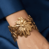 Aster — Gold Swirl Petal Cuff Bracelet worn on wrist Aster — Gold Swirl Petal Cuff Bracelet worn on wrist