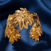 Aster — Gold Swirl Petal Cuff Bracelet worn on wrist Aster — Gold Swirl Petal Cuff Bracelet worn on wrist