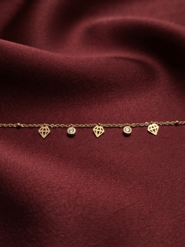 Diamant — Rose Gold Diamond Charm Bracelet worn on wrist Diamant — Rose Gold Diamond Charm Bracelet worn on wrist