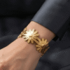 Marguerite — Gold Daisy Flower Bracelet worn on wrist Marguerite — Gold Daisy Flower Bracelet worn on wrist