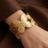 Papillon — Gold Butterfly Cuff Bracelet worn on wrist Papillon — Gold Butterfly Cuff Bracelet worn on wrist