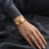 Marguerite — Gold Daisy Flower Bracelet worn on wrist Marguerite — Gold Daisy Flower Bracelet worn on wrist