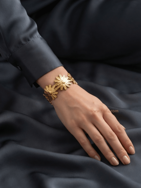 Marguerite — Gold Daisy Flower Bracelet worn on wrist Marguerite — Gold Daisy Flower Bracelet worn on wrist