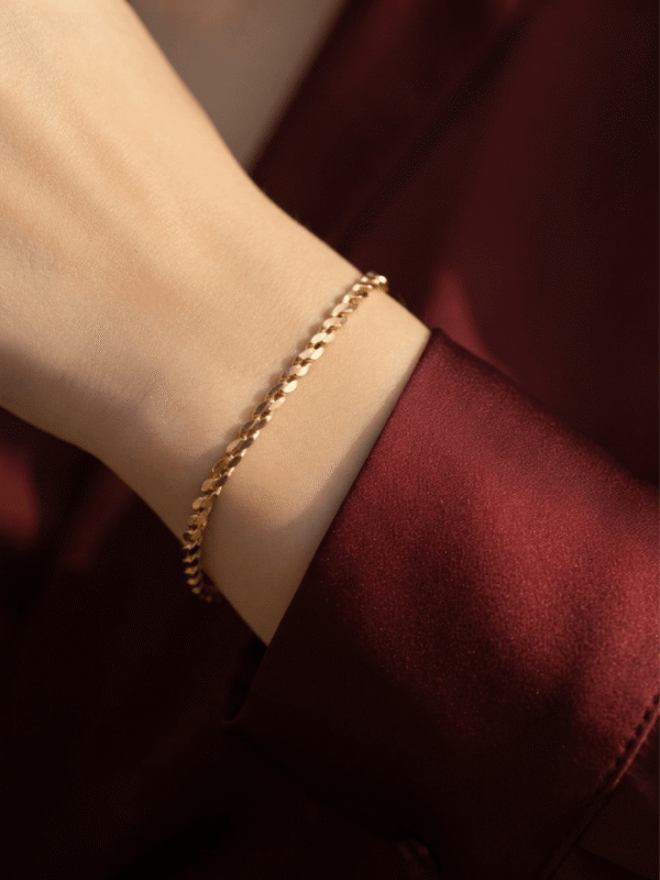 Zanjeer — Gold Herringbone Chain Bracelet worn on wrist Zanjeer — Gold Herringbone Chain Bracelet worn on wrist