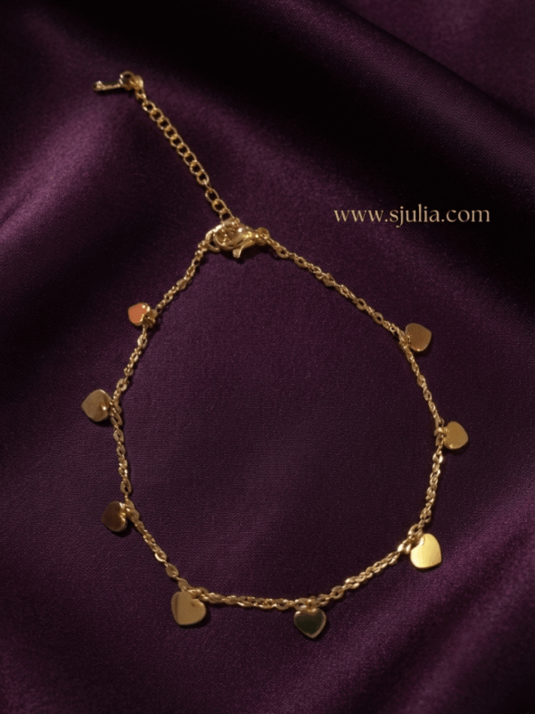 Dilruba — Gold Dangling Heart Charm Chain flat lay Dilruba — Gold Dangling Heart Charm Chain flat lay