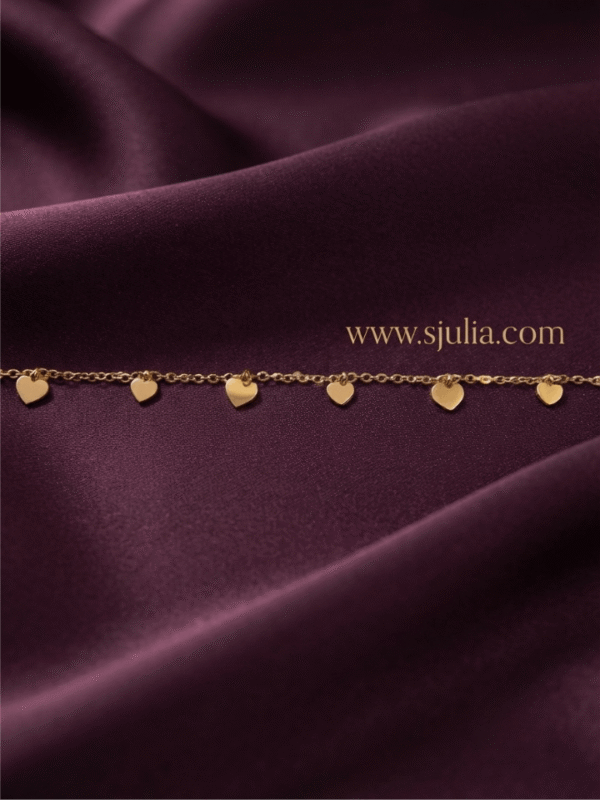 Dilruba — Gold Dangling Heart Charm Chain flat lay Dilruba — Gold Dangling Heart Charm Chain flat lay