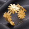 Marguerite — Gold Daisy Flower Bracelet worn on wrist Marguerite — Gold Daisy Flower Bracelet worn on wrist
