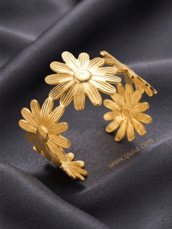 Marguerite — Gold Daisy Flower Bracelet worn on wrist Marguerite — Gold Daisy Flower Bracelet worn on wrist