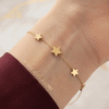 Sitara — Gold Star Charm Bracelet worn on wrist Sitara — Gold Star Charm Bracelet worn on wrist
