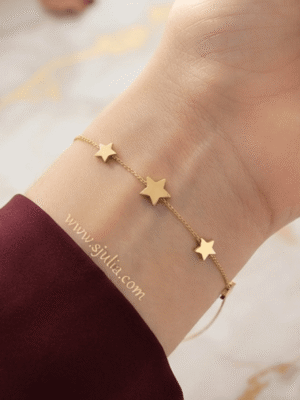 Sitara — Gold Star Charm Bracelet worn on wrist Sitara — Gold Star Charm Bracelet worn on wrist