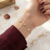 Sitara — Gold Star Charm Bracelet worn on wrist Sitara — Gold Star Charm Bracelet worn on wrist