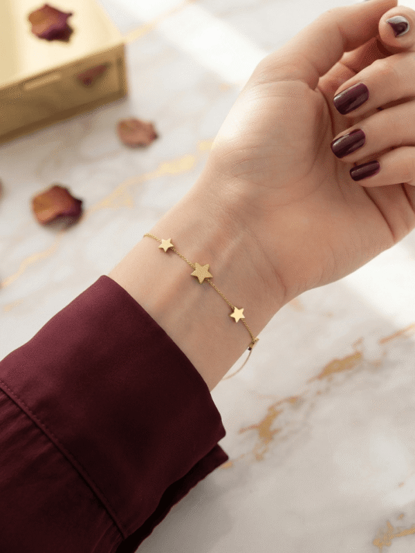 Sitara — Gold Star Charm Bracelet worn on wrist Sitara — Gold Star Charm Bracelet worn on wrist