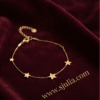Sitara — Gold Star Charm Bracelet worn on wrist Sitara — Gold Star Charm Bracelet worn on wrist