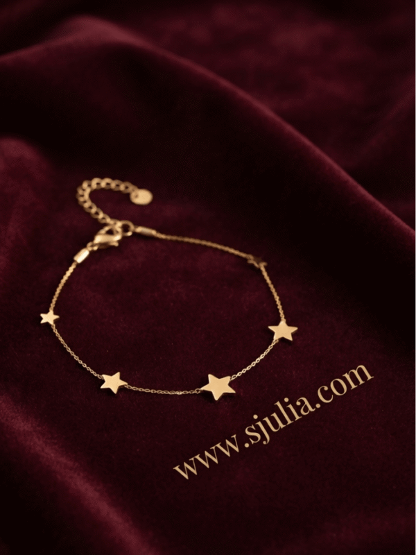 Sitara — Gold Star Charm Bracelet worn on wrist Sitara — Gold Star Charm Bracelet worn on wrist