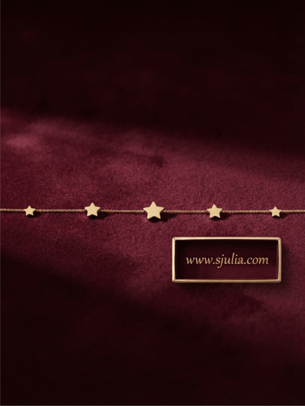 Sitara — Gold Star Charm Bracelet worn on wrist Sitara — Gold Star Charm Bracelet worn on wrist