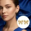 Rivaa – Textured Gold Bow Stud Earrings Rivaa – Textured Gold Bow Stud Earrings