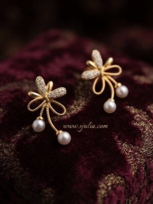 Reyna – Gold Pearl Drop Bow Studs Reyna – Gold Pearl Drop Bow Studs