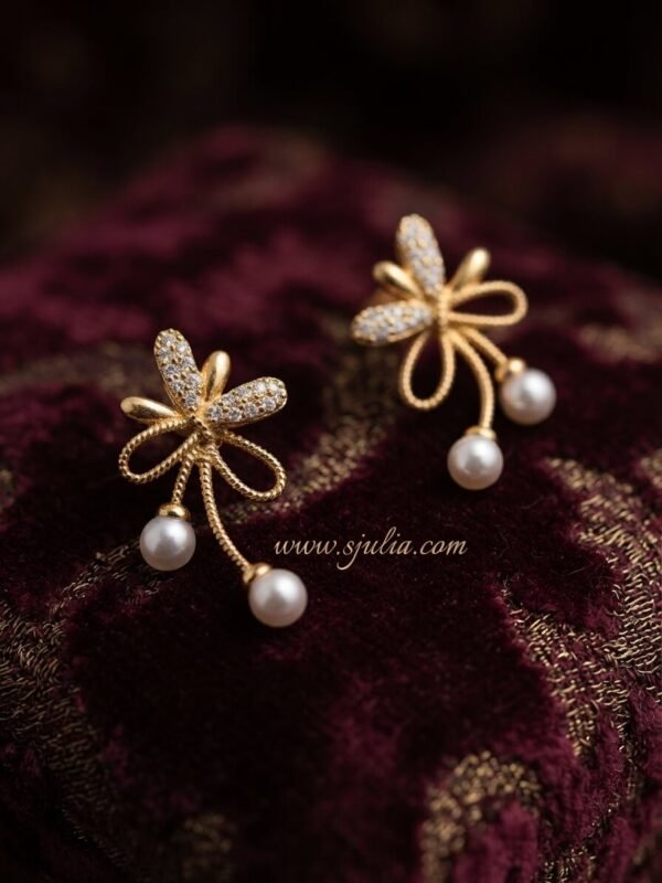 Reyna – Gold Pearl Drop Bow Studs Reyna – Gold Pearl Drop Bow Studs