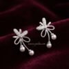 Reyna – Gold Pearl Drop Bow Studs Reyna – Gold Pearl Drop Bow Studs